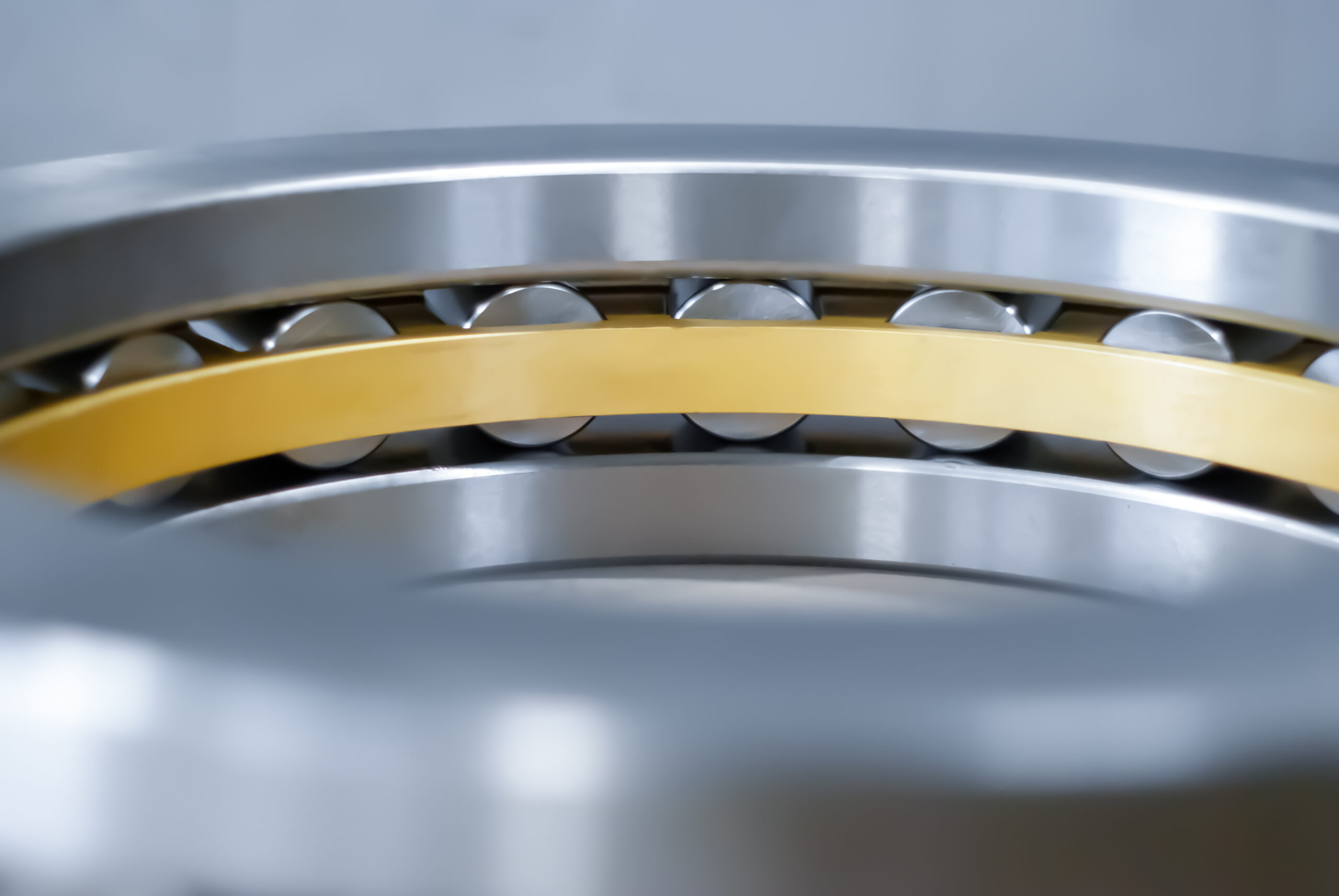 blurred industrial background with fragment roller bearing close up