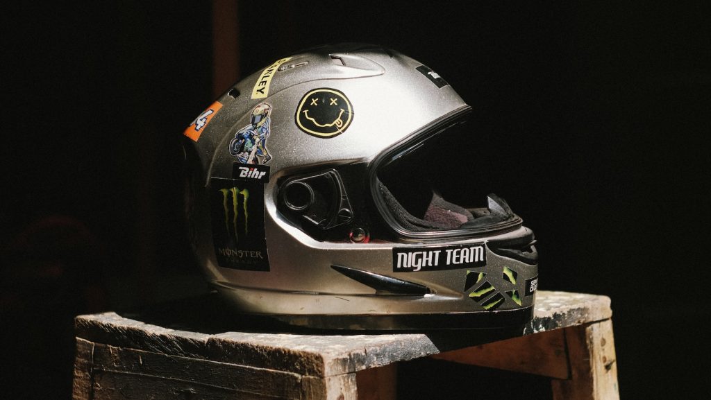a helmet sitting on top of a wooden block