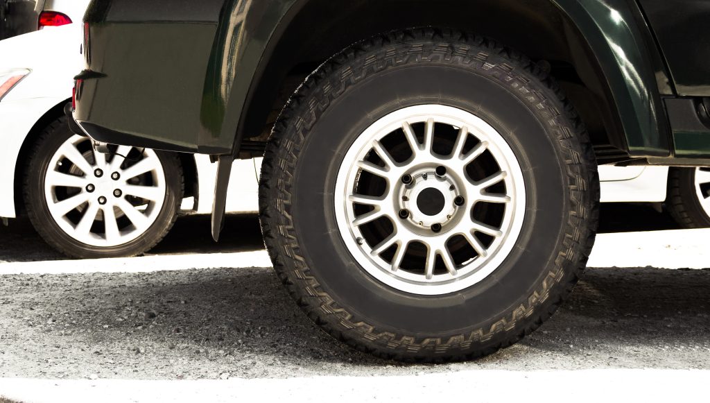 All season tire on wheel rim for crossovers and off road vehicles